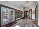 Bright workout room with an exercise machine and large windows overlooking the yard, ideal for fitness at 9324 Carolview Way, Orlando, FL 32836
