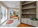 Elegant foyer with tile flooring, decorative shelves, and an open view into the living room at 9324 Carolview Way, Orlando, FL 32836