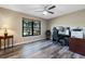 Well-lit home office with a comfortable desk, chair, and a large window with a peaceful view at 9324 Carolview Way, Orlando, FL 32836