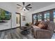 Comfortable living room with plush sofa, modern coffee table, and mounted TV for relaxing evenings at 9324 Carolview Way, Orlando, FL 32836