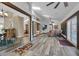 Open concept living room featuring wood flooring and large windows providing natural light at 9324 Carolview Way, Orlando, FL 32836