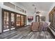 Comfortable living room with plush seating, a mounted TV, and access to other rooms in the home at 9324 Carolview Way, Orlando, FL 32836