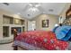 Comfortable main bedroom with fireplace, vaulted ceiling, and cozy bedding at 9324 Carolview Way, Orlando, FL 32836