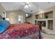 Serene main bedroom with a fireplace, tv, and ensuite bathroom for ultimate relaxation at 9324 Carolview Way, Orlando, FL 32836
