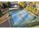 Aerial view of the well-maintained community tennis courts with lush green landscaping at 9324 Carolview Way, Orlando, FL 32836
