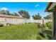 Grassy backyard with a white fence and manicured landscaping at 9543 Buxton, Orlando, FL 32817