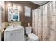 Cozy bathroom with a seashell-themed shower curtain and modern vanity at 9543 Buxton, Orlando, FL 32817