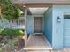 Inviting covered entry features a classic front door and tiled entryway at 9543 Buxton, Orlando, FL 32817