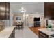 Updated kitchen with modern appliances and countertops opens up to the living room and dining area at 9543 Buxton, Orlando, FL 32817