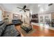 Open-concept living area with wood flooring, crown molding, and an adjacent kitchen at 9543 Buxton, Orlando, FL 32817