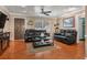 Spacious living room boasts hardwood floors, crown molding, and natural light, creating a comfortable and stylish space at 9543 Buxton, Orlando, FL 32817