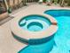 Close-up of the inground pool featuring an attached spa and a tiled edge, perfect for backyard relaxation and entertainment at 9543 Buxton, Orlando, FL 32817
