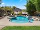 Backyard with a kidney shaped pool and spa, and patio area perfect for outdoor relaxation at 9543 Buxton, Orlando, FL 32817