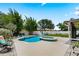 Backyard with a lagoon-shaped pool and spa, surrounded by lush landscaping and a spacious patio area for outdoor lounging at 9543 Buxton, Orlando, FL 32817