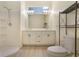 Bright bathroom with double vanity, large mirror, modern fixtures, and walk-in shower at 1065 Universal Rest Pl, Kissimmee, FL 34744