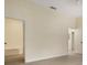 Light-filled bedroom featuring stylish doors leading to the bath at 1065 Universal Rest Pl, Kissimmee, FL 34744