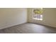 Bright, spacious room with lots of light from a large window at 1065 Universal Rest Pl, Kissimmee, FL 34744