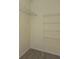 Walk-in closet featuring built-in shelving, offering plenty of storage space at 1065 Universal Rest Pl, Kissimmee, FL 34744