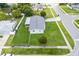 Aerial shot of a home showcasing its spacious lawn, fenced yard and residential neighborhood at 10800 Fernando St, Orlando, FL 32825