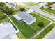 This aerial captures the home's spacious lawn, fenced yard, and location in a residential neighborhood at 10800 Fernando St, Orlando, FL 32825