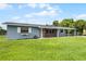 Charming single story home featuring a well maintained lawn, inviting entrance, and covered parking at 10800 Fernando St, Orlando, FL 32825