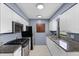 The kitchen includes stainless steel appliances, granite countertops, and white cabinetry at 10800 Fernando St, Orlando, FL 32825