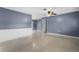 Bright living room with natural light, neutral walls, and easy access to other rooms at 10800 Fernando St, Orlando, FL 32825