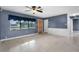 Inviting living room with natural light and a glimpse of the kitchen at 10800 Fernando St, Orlando, FL 32825