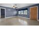 Cozy living room with a large window and a wooden door at 10800 Fernando St, Orlando, FL 32825