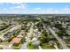 A neighborhood aerial view showcasing a residential area with mature trees and diverse homes at 10800 Fernando St, Orlando, FL 32825