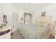 Cozy bedroom with bright window, neutral carpet and a decorative, paneled headboard at 1125 Lake Shadow Cir # 5308, Maitland, FL 32751
