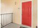 Close-up of a bright red front door with unit number 5308 on a sunny day at 1125 Lake Shadow Cir # 5308, Maitland, FL 32751