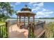 Charming lakeside gazebo offering serene views and a relaxing outdoor space at 1125 Lake Shadow Cir # 5308, Maitland, FL 32751