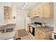 Bright kitchen featuring wood cabinets, neutral countertops, and a full appliance package at 1125 Lake Shadow Cir # 5308, Maitland, FL 32751
