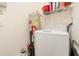 Laundry room with washer and dryer, hot water tank and wire shelving at 1125 Lake Shadow Cir # 5308, Maitland, FL 32751