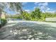 Well-maintained tennis court surrounded by lush greenery, perfect for recreational play at 1125 Lake Shadow Cir # 5308, Maitland, FL 32751