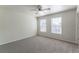 Sunny bedroom featuring a ceiling fan and multiple windows for natural light at 1129 Royal Ridge Dr, Davenport, FL 33896