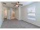 Bright bedroom with carpet, windows, and a ceiling fan at 1129 Royal Ridge Dr, Davenport, FL 33896
