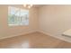 Bright dining area featuring tile floors, a large window, and natural light at 1129 Royal Ridge Dr, Davenport, FL 33896