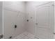 Laundry room with tiled floor and shelving at 1129 Royal Ridge Dr, Davenport, FL 33896