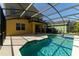Gorgeous screened-in pool, with clear blue water, set against a private backyard, creating a serene oasis at 1129 Royal Ridge Dr, Davenport, FL 33896