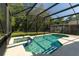Relaxing pool with spa, featuring cool, clear water and tiled accents, perfect for unwinding after a long day at 1129 Royal Ridge Dr, Davenport, FL 33896