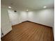An interior view of a bedroom showing wood floors, fresh paint, and natural light at 1130 W Lake Brantley Rd, Altamonte Springs, FL 32714