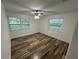 Empty bedroom featuring new flooring and lots of natural light coming in from two windows at 1130 W Lake Brantley Rd, Altamonte Springs, FL 32714