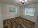 Bright bedroom with modern flooring and two windows, providing lots of natural light at 1130 W Lake Brantley Rd, Altamonte Springs, FL 32714