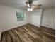 Spacious bedroom with new floors, ceiling fan, and a closet at 1130 W Lake Brantley Rd, Altamonte Springs, FL 32714