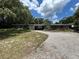 Charming single-story home featuring an expansive front yard and rock driveway at 1130 W Lake Brantley Rd, Altamonte Springs, FL 32714