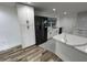 Contemporary kitchen boasting a large refrigerator, quartz countertops, and updated appliances at 1130 W Lake Brantley Rd, Altamonte Springs, FL 32714