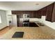 Updated kitchen boasts granite countertops, stainless appliances, and ample cabinetry for storage at 1130 W Lake Brantley Rd, Altamonte Springs, FL 32714
