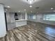 An open floor plan showcasing the kitchen with an island and lots of natural light at 1130 W Lake Brantley Rd, Altamonte Springs, FL 32714